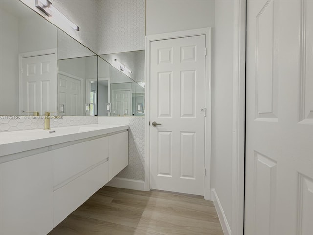 bathroom featuring wood finished floors and vanity