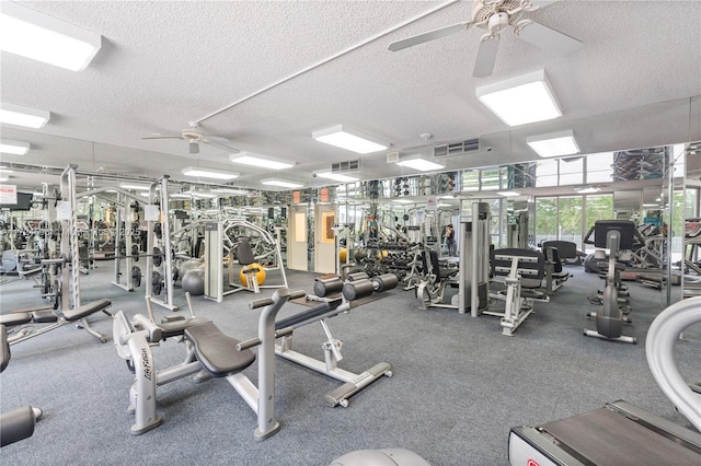 gym with a textured ceiling and ceiling fan