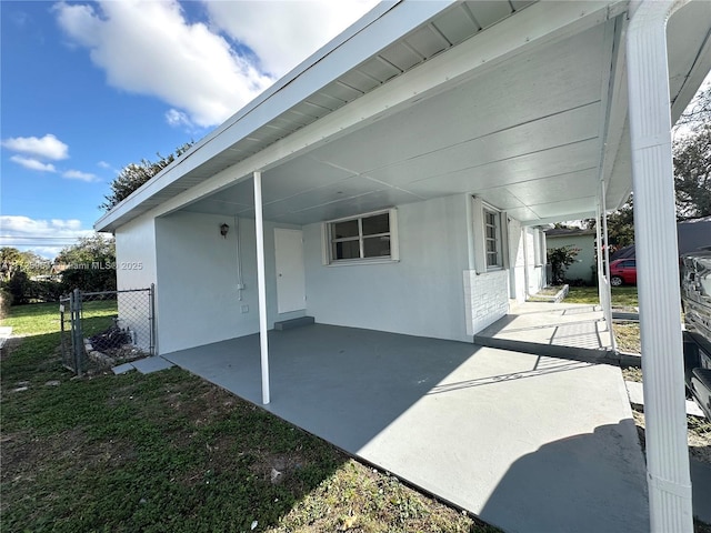 view of patio featuring a carport