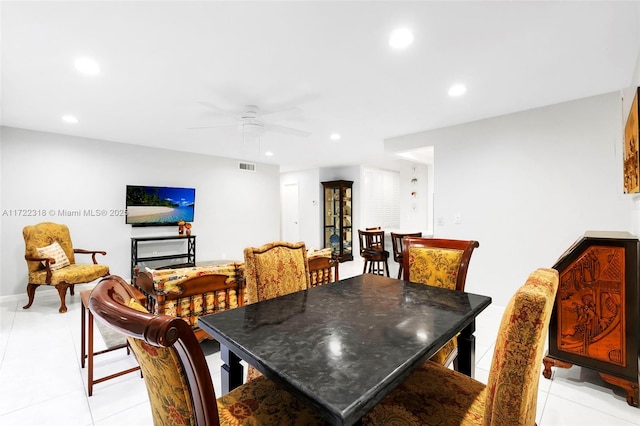 tiled dining room with ceiling fan