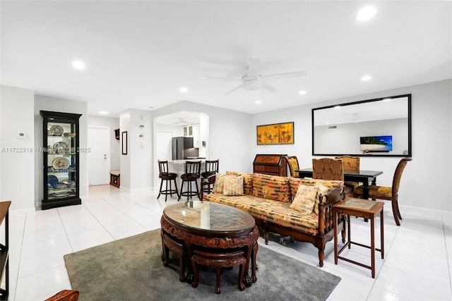 living room with light tile patterned flooring and ceiling fan