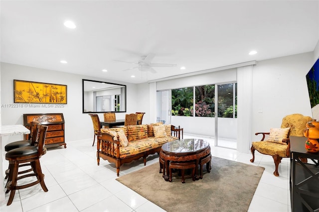 tiled living room with ceiling fan