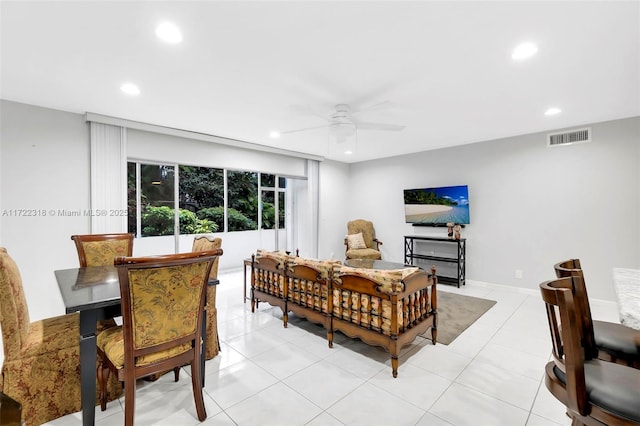 tiled living room featuring ceiling fan