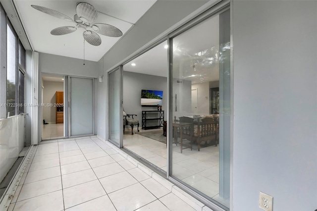 interior space with ceiling fan and light tile patterned floors