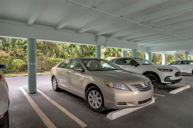 view of vehicle parking featuring a carport