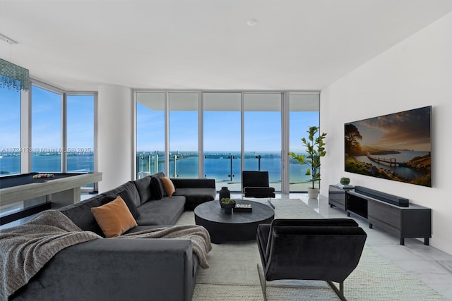 living room featuring pool table and floor to ceiling windows