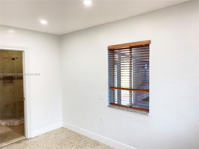 6181 SW 20th St, West Miami, FL 33155 - unfurnished bedroom featuring baseboards, speckle patterned floor, ensuite bathroom, and recessed lighting