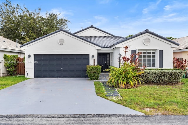 ranch-style house featuring a front lawn and a garage