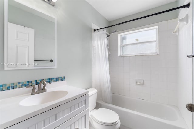 full bathroom with toilet, shower / tub combo, and vanity