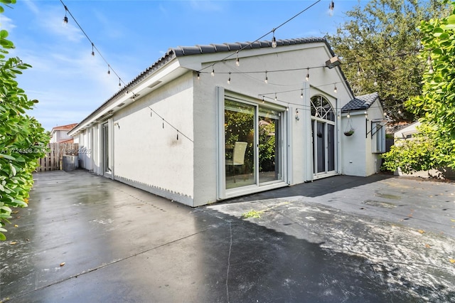 rear view of property featuring a patio area