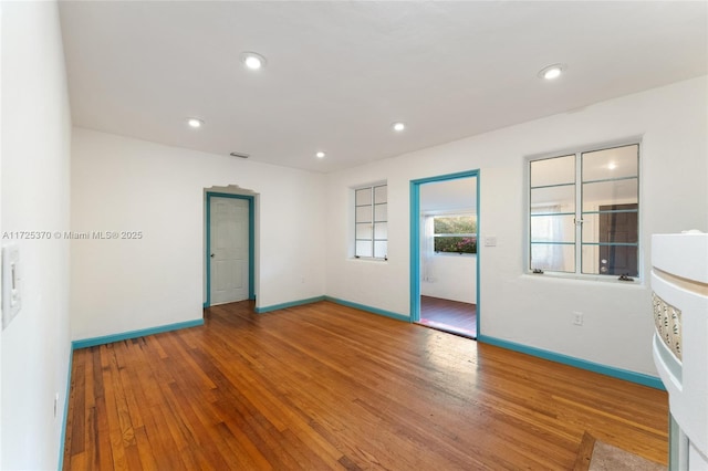 unfurnished room featuring hardwood / wood-style floors