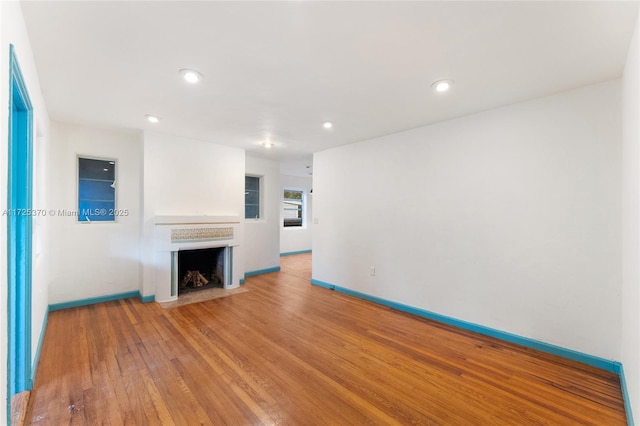 unfurnished living room with hardwood / wood-style flooring