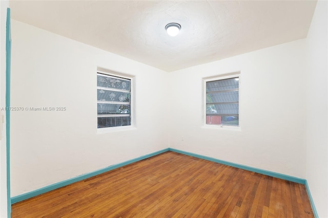 unfurnished room featuring wood-type flooring