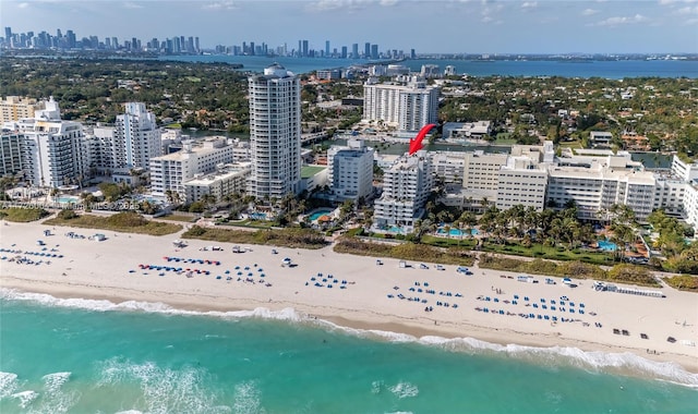 aerial view with a beach view and a water view