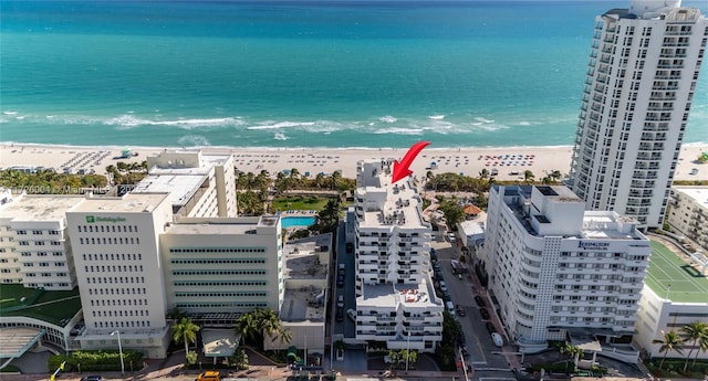 bird's eye view featuring a beach view and a water view