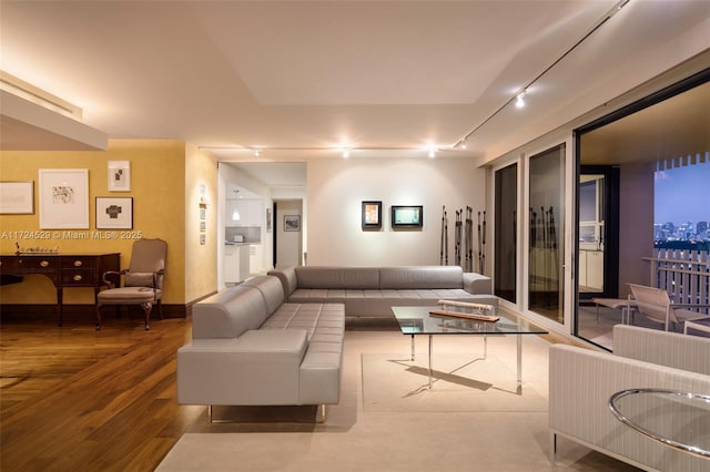 living room with track lighting and hardwood / wood-style floors