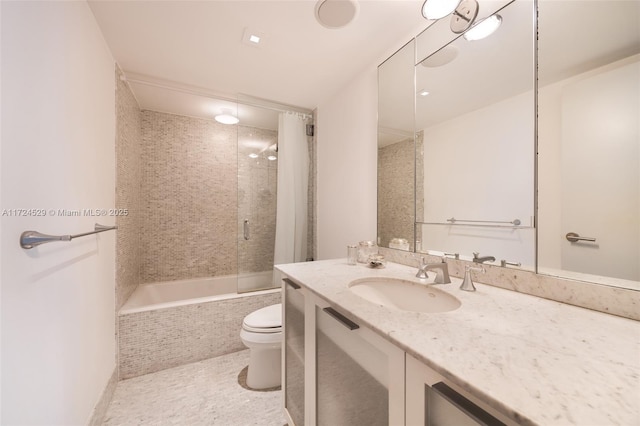 full bathroom with tile patterned flooring, toilet, vanity, and tiled shower / bath