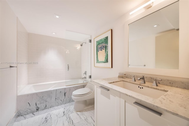 full bathroom featuring toilet, vanity, and tiled shower / bath combo