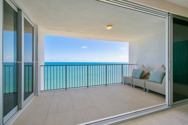 balcony featuring a water view