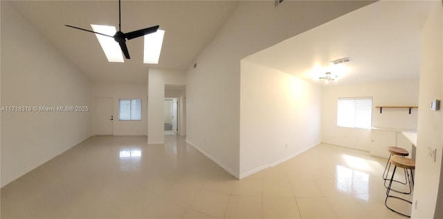 tiled empty room with a high ceiling