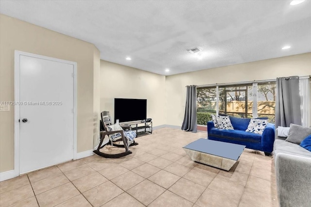 tiled living room with a textured ceiling