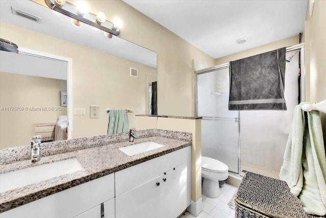 bathroom with toilet, an enclosed shower, tile patterned flooring, and vanity