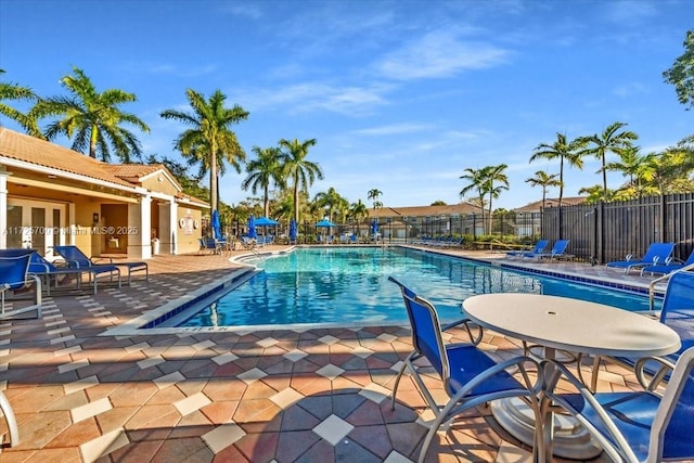 view of swimming pool with a patio