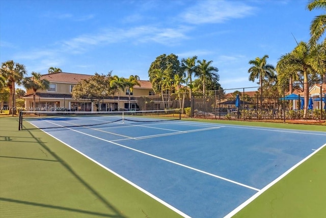 view of tennis court featuring basketball court