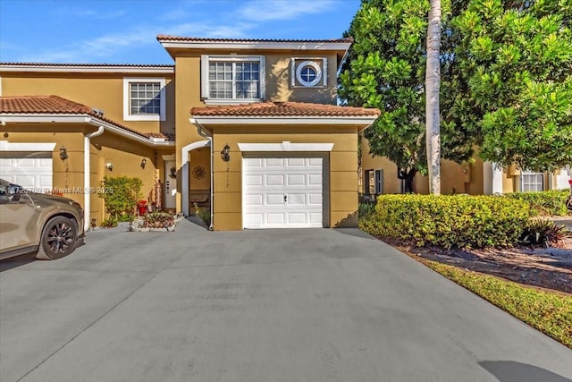 mediterranean / spanish-style home featuring a garage