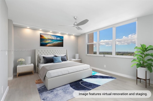 bedroom with ceiling fan and light hardwood / wood-style floors