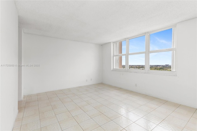 empty room with a textured ceiling