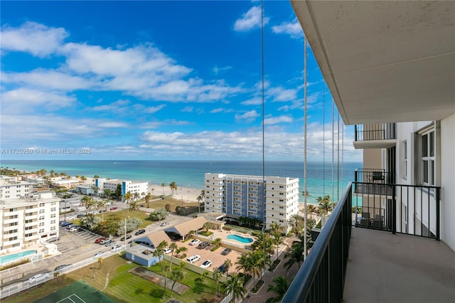 balcony featuring a water view