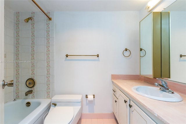 full bathroom with toilet, tile patterned flooring, tiled shower / bath, and vanity