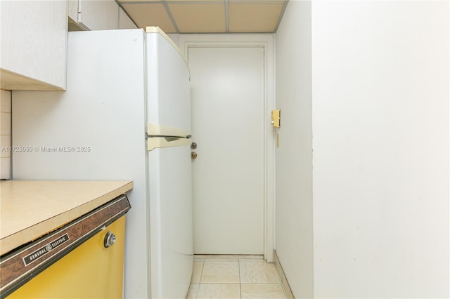 interior space with white refrigerator and dishwasher