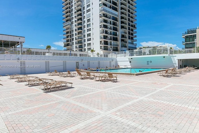 view of swimming pool with a patio area