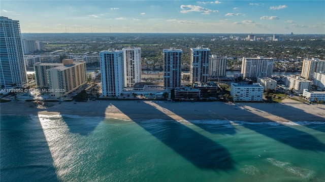 bird's eye view with a beach view and a water view