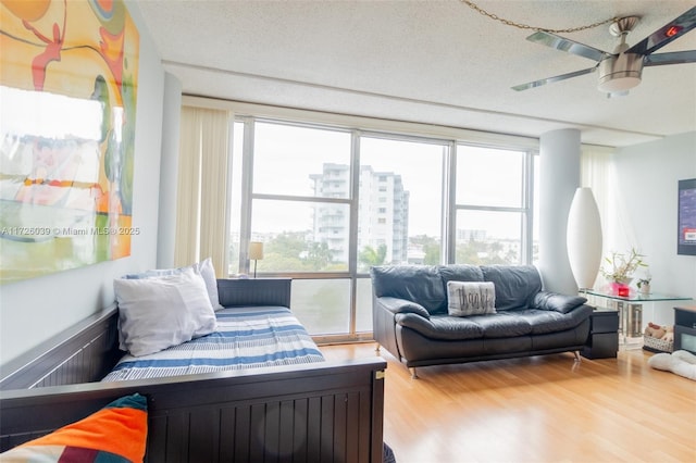 sunroom / solarium featuring ceiling fan