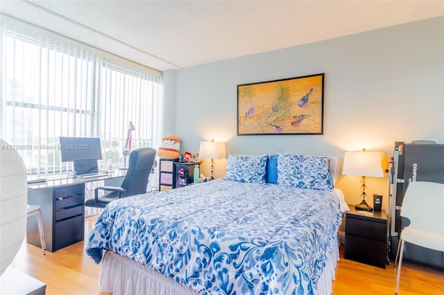 bedroom with light hardwood / wood-style flooring