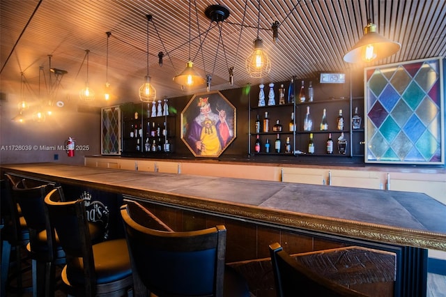 bar with decorative light fixtures