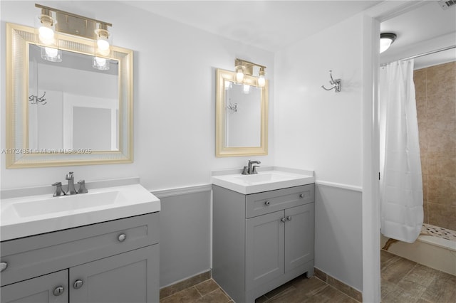 bathroom with vanity and curtained shower