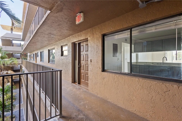 view of patio / terrace featuring a balcony and sink