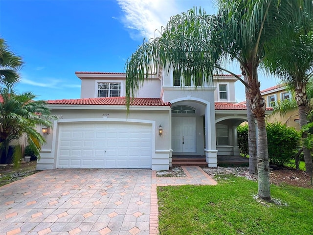 mediterranean / spanish-style house featuring a garage