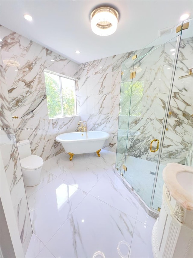 full bathroom featuring toilet, vanity, tile walls, and separate shower and tub