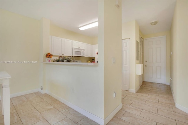 kitchen featuring white cabinets