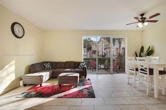 tiled living room with ceiling fan