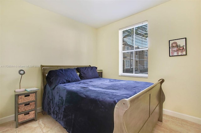 bedroom featuring light tile patterned floors