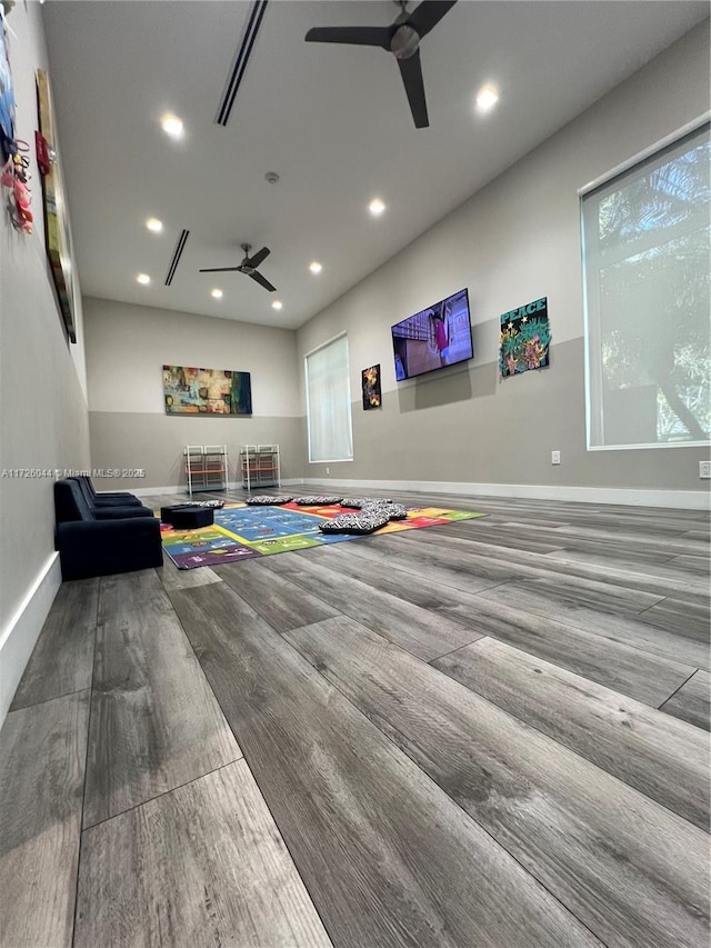 rec room featuring hardwood / wood-style flooring and ceiling fan