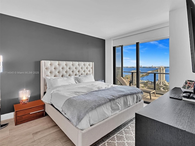 bedroom featuring a water view