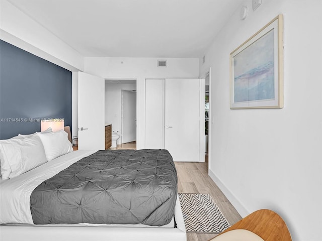 bedroom with light hardwood / wood-style floors