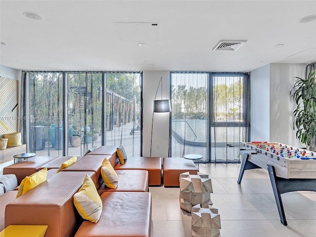 living room featuring a wall of windows